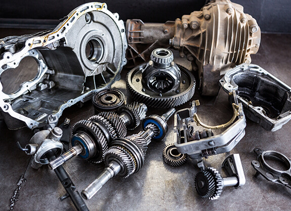Disassembled transmission components on a workshop bench