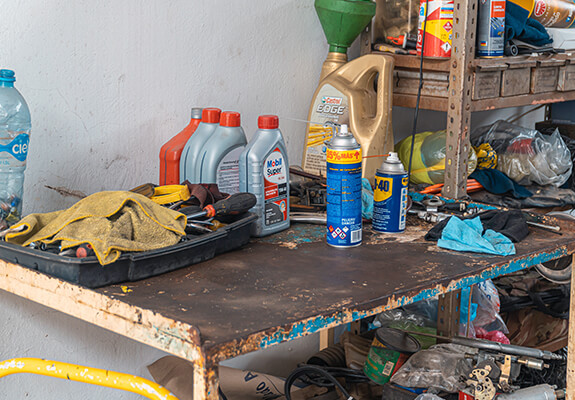 Automotive oils and workshop tools on a workbench