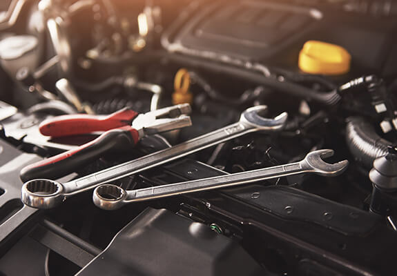 Workshop tools arranged in an engine bay